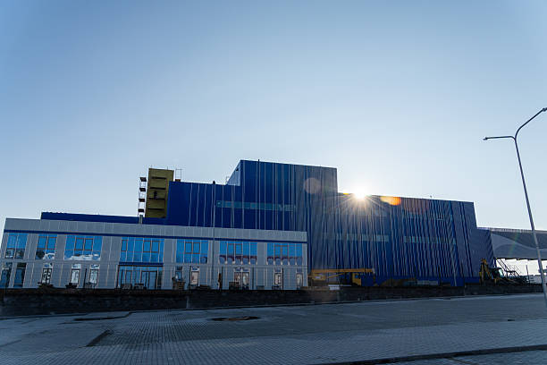 istock A large, modern industrial building with a vibrant blue facade 2249371002