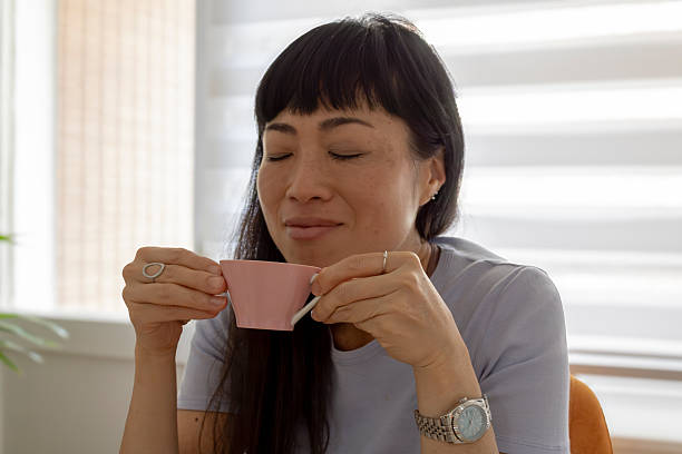 istock Woman enjoying coffee aroma savoring peaceful moment 2249372661