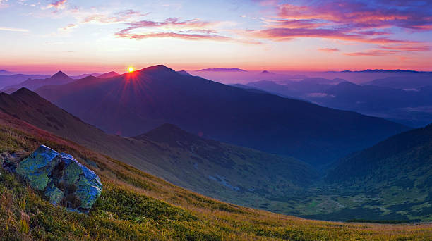 istock Breathtaking sunrise over rugged mountain peaks. 2249372685