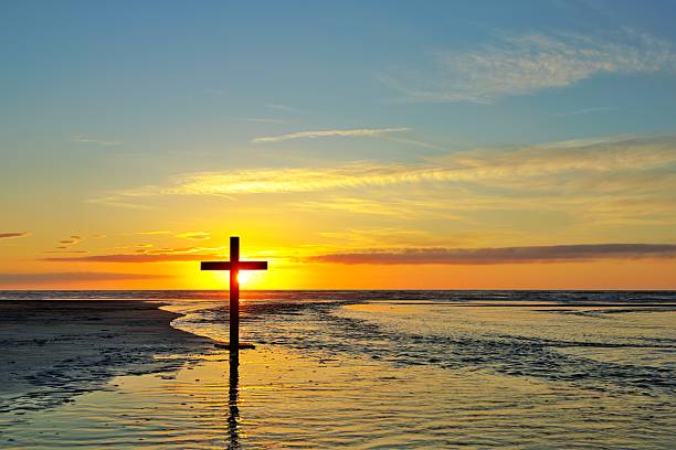 istock Dark Cross Sun Behind Flowing Water 2249375109