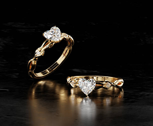 istock Gold heart diamond ring placed on black glossy background 3d rendering 2249377456