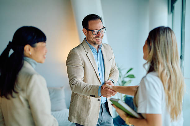 istock Business colleagues shaking hands making agreement at meeting 2249377763