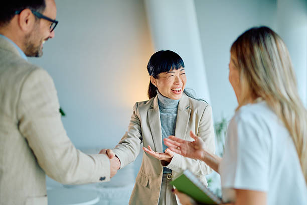 istock Diverse business people shaking hands in office meeting 2249378004