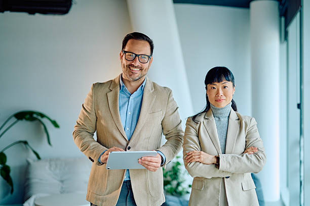 istock Diverse business partners collaborating in modern office space 2249378508