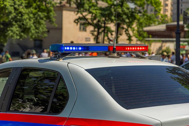 istock White police car with emergency lights in urban setting 2249378630