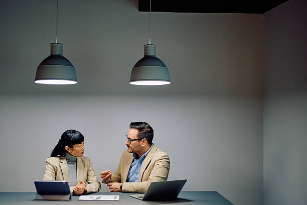 istock Business colleagues having serious discussion during meeting in office 2249380185