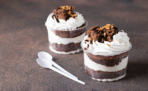 istock Dessert of chocolate sponge cake, whipped cream and nuts 2249384399