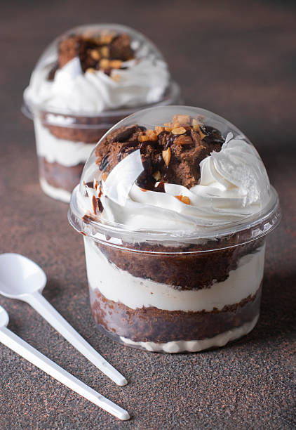 istock Takeaway dessert of chocolate sponge cake, whipped cream and nuts 2249384403