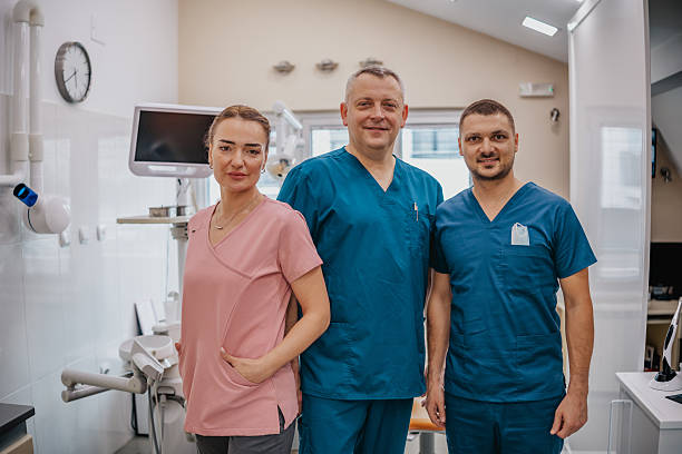 istock Dental team in action at a modern clinic during a routine workday providing care and services 2249385104