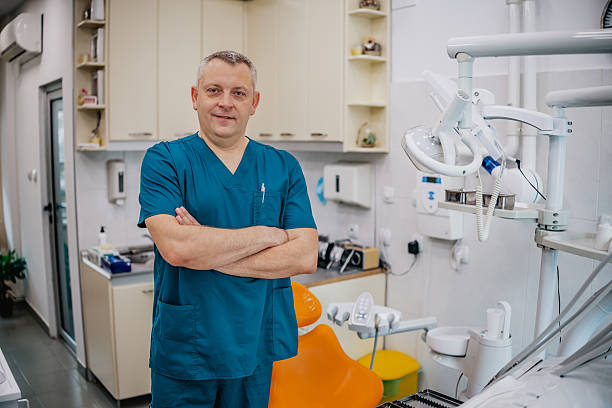 istock Dentist standing confidently in a modern dental office ready for patient care 2249391531