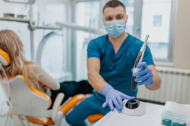 istock Dentist working with patient in modern dental office during routine checkup with advanced tools and equipment 2249392361