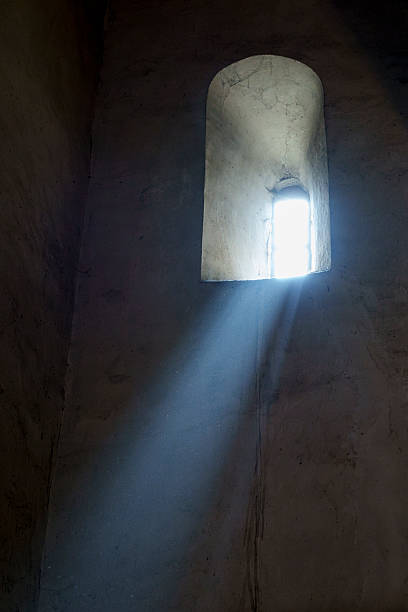 istock Mystic light beam through narrow ancient church window 2249394995