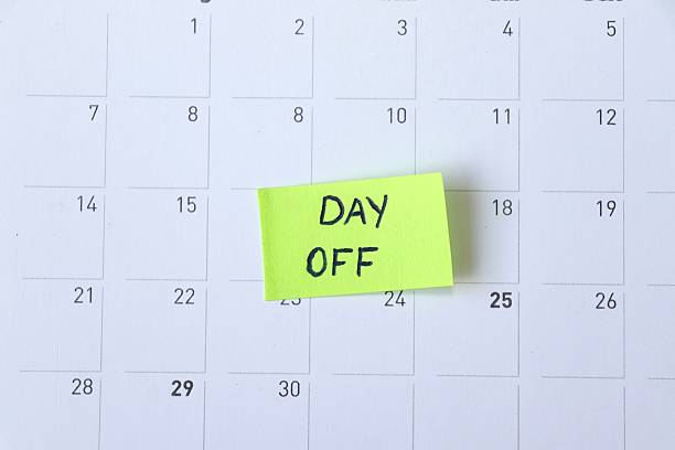 istock Day Off Marked on Calendar. Sticky Note Reminder. Workplace message in the office. Concept of absence from work and day off. 2249395399