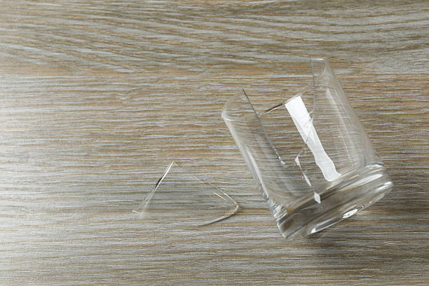 istock Broken glass on a wooden background 2249401938