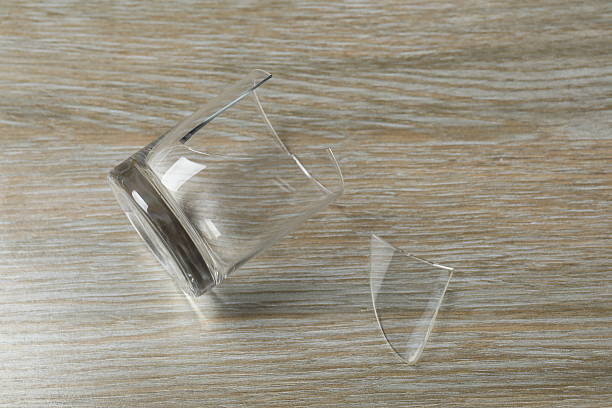 istock Broken glass on a wooden background 2249401986