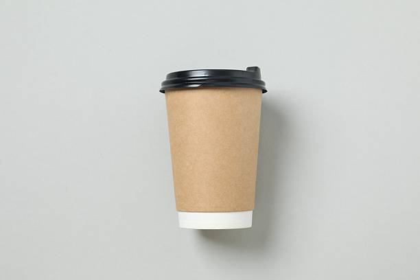 istock Paper cup of coffee on gray background 2249402723