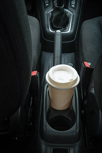 istock Coffee cup in car holder while traveling 2249403879