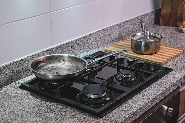istock Modern kitchen gas hob with cooking pan and pot 2249404525