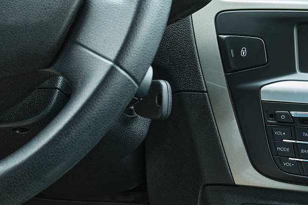 istock Car steering wheel and ignition key for driving 2249404653