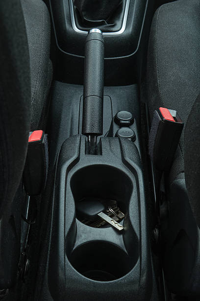 istock Car interior with keys in cupholder and handbrake 2249404686