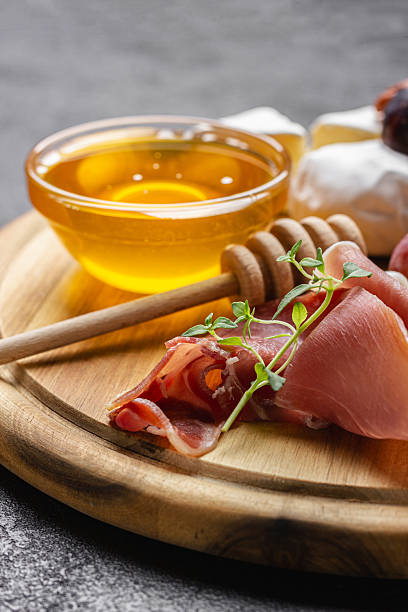 istock Appetizer board with meat, cheese, grapes, nuts and fresh figs. 2249404701