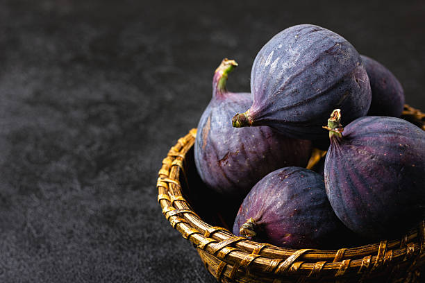 Fresh figs in a straw basket.