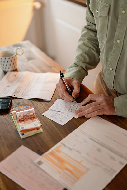 istock Financial Planning At Home With Cash And Documents 2249408128
