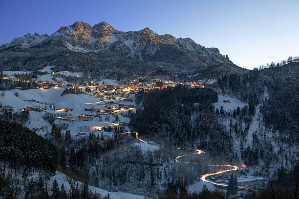 istock Mountain village in the evening after the snowfall 2249410105