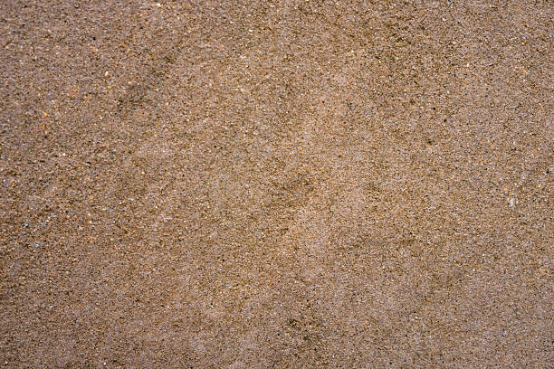 istock fine grained tan brown sand or concrete surface texture with subtle darker stain, detailed earth tone construction background, concept of building material, architecture, aged flooring 2249411463
