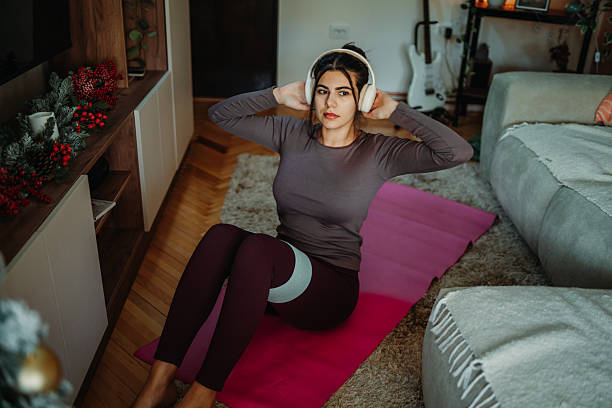 istock Woman exercising home workout during christmas holidays 2249412086
