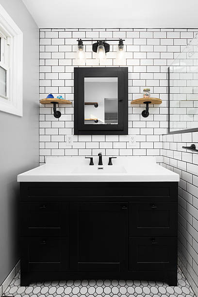 istock A bathroom with a black cabinet and subway tile wall. 2249418056