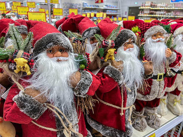 Close up of Christmas baubles of Santa in car