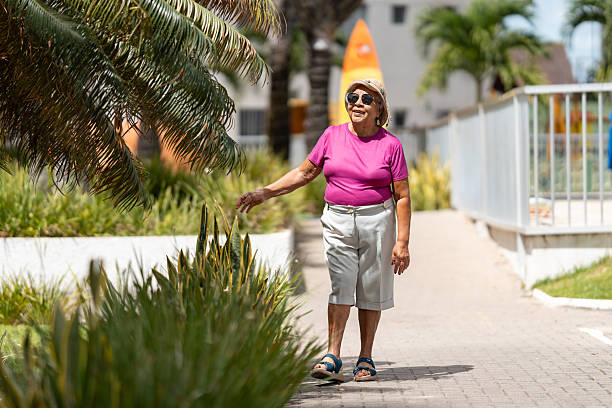 istock Happy elderly woman walking in the condominium 2249420101