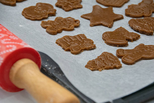 istock Christmas gingerbread cookies before baking with rolling pin 2249428400