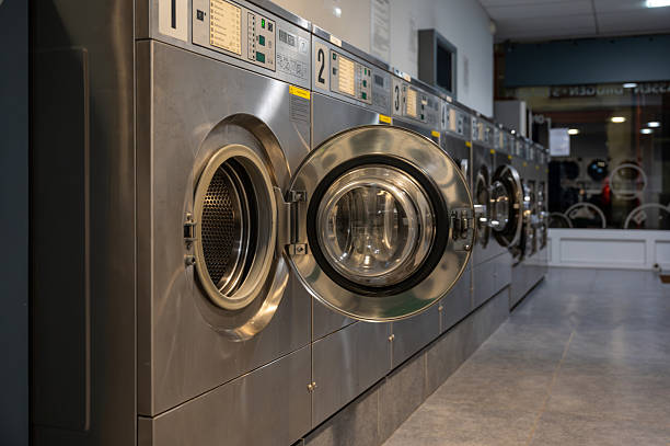 istock Row of washing machines in Public laundromat 2249429997