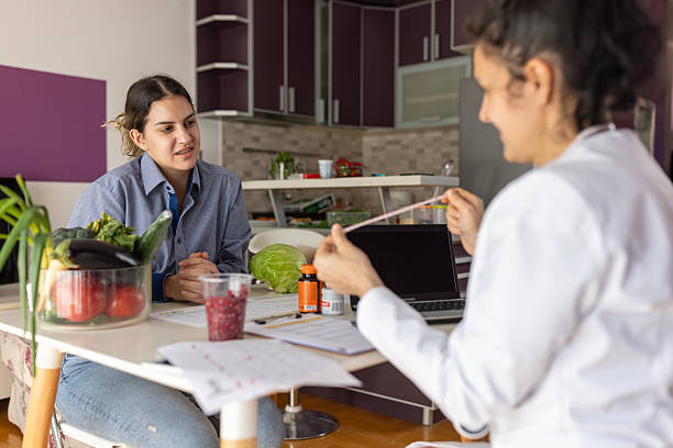 istock Nutritionist discussing diet plan with young patient 2249430375