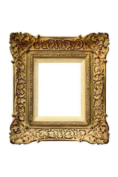 Intricately carved vintage picture frame with ornate floral scrollwork, aged gold patina, and empty white center space