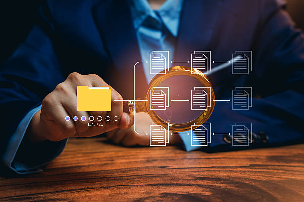 istock Hand holding magnifying glass with document icons, data search workflow, information discovery insight, digital organization process, file management improvement, documentation concept 2249442341