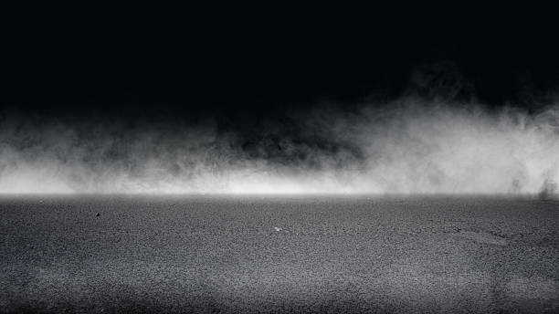 istock Interior view of a dramatic dark room with smoke and a light ray for the stage background. Mockup, copy space, and template 2249445090