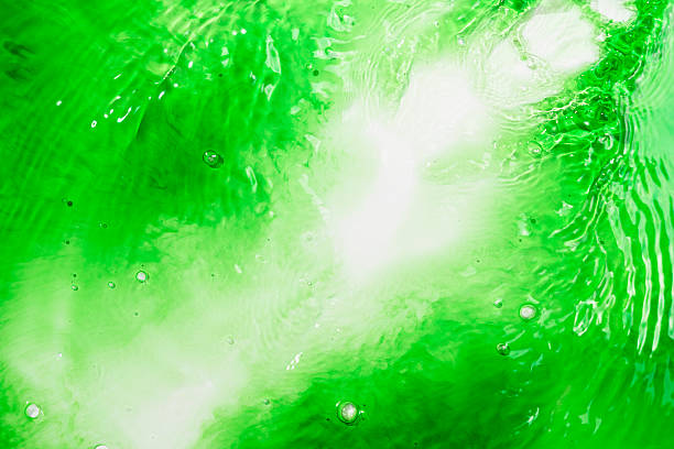 Closeup view of vibrant green liquid. Creating a refreshing and dynamic abstract background