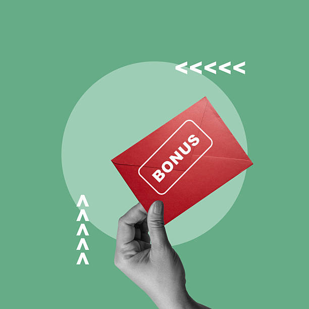 istock Human hand holding a red envelope with the word BONUS on it with a colored background. Concept of Bonus. Collage art 2249446808