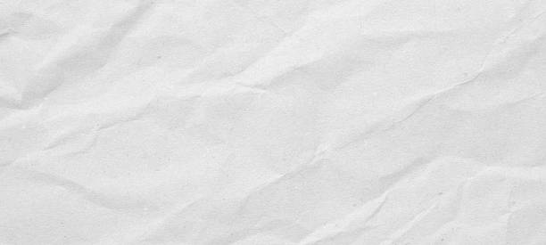 istock Abstract white crumpled and creased recycle paper texture background 2249447620