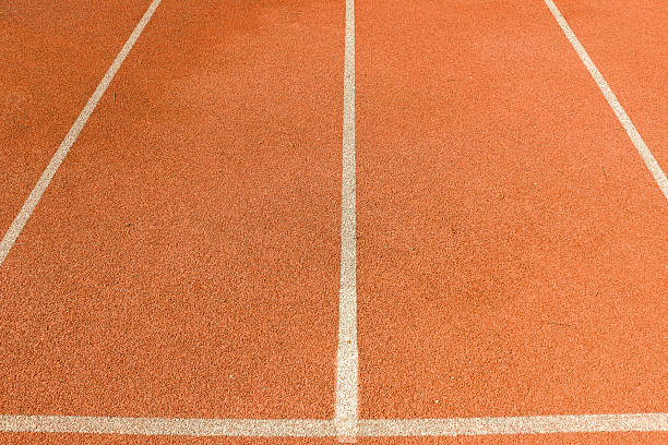 istock Red running track with white marking lines. 2249447846