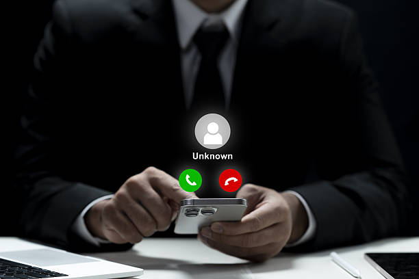 istock Businessman holding a cellphone with an unknown incoming call displayed on the screen. Concept of scam or phishing 2249447870