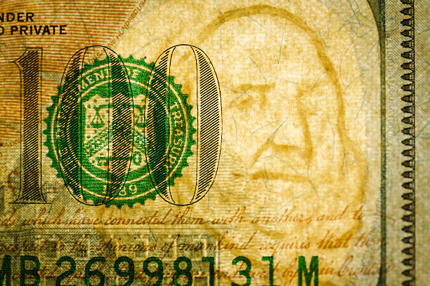 istock Macro detail of worn currency surface and seal 2249448130