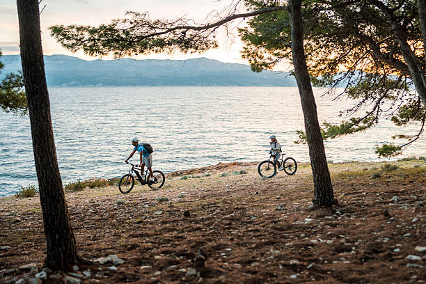istock Diverse Couple Enjoys Seaside Sunrise on E-Bikes 2249449163