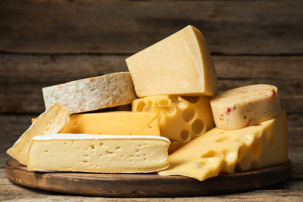 istock Different types of cheese on wooden table 2249450999