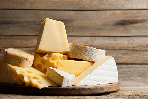 istock Different types of cheese on wooden table 2249451001