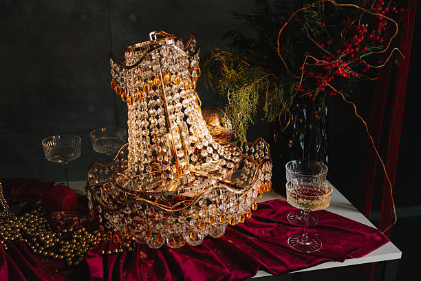 istock Christmas table setup with sparkling candles and glass decorations. 2249451650