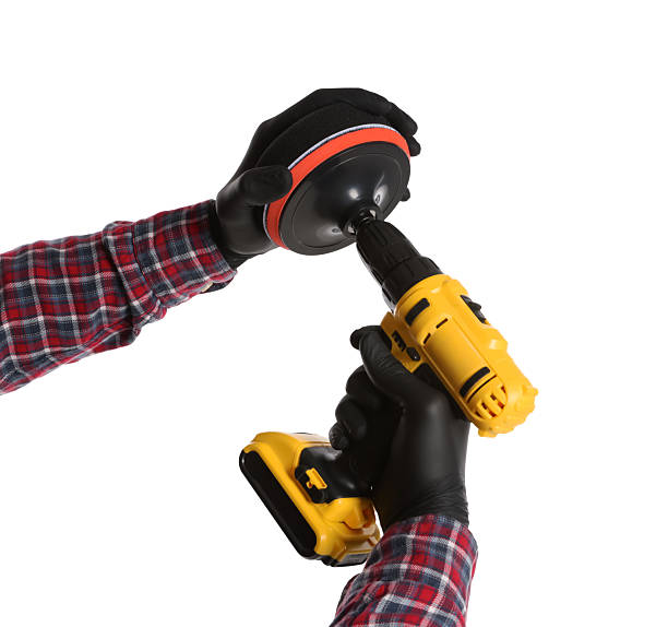istock Man holding electric screwdriver with polish pad on white background, closeup 2249452035